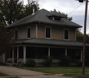 Foursquare house - two and one-half story with wrap-around porch.