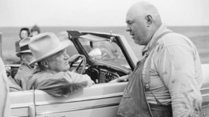 President Franklin D. Roosevelt visited the drought stricken Texas Panhandle in July 1938.  Here he listens as an unidentified farmer explains the crisis.  Ironically as FDR rode toward an Amarillo park for a speech, the sky opened and the rains came!  (Photo courtesy of www.history.com.)