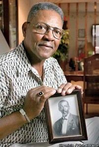 Chester Hurdle holds a photo of his father Andrew Jackson Hurdle in his 80's. This photo was taken in 2002 as part of an article on SFGate online news.