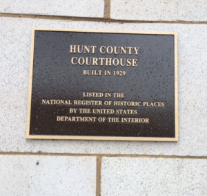 The plaque on the Hunt County Courthouse that designates it is on the National Register of Historic Places.
