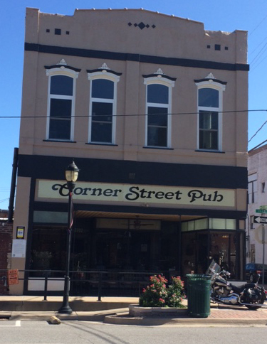 Corner Pub at the corner of Wesley and Lee in Greenville.  Look on the exterior wall to the left of the entrance.  Remember yellow and black for your clue.  Good luck!