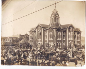 An estimated 5000 citizens gathered at the Hunt County Courthouse in Greenville, Texas on April 21, 1917.  Instead of traditionally celebrating San Jacinto Day, when Texas won her independence from Mexico, the crowd eagerly listened to Governor James Ferguson and showed support for President Wilson’s war tactics.  Note the enormous American flag on the flagpole atop the copula. 