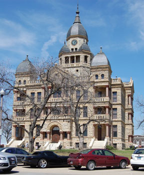Denton County Courthouse located in the center of historic downtown Denton.  Designed by W. C. Dodson in 1895 the structure cost $150,000 and opened in 1897.  The county and town were named in honor of John B. Denton, frontier preacher, and lawyer buried on the east lawn. 